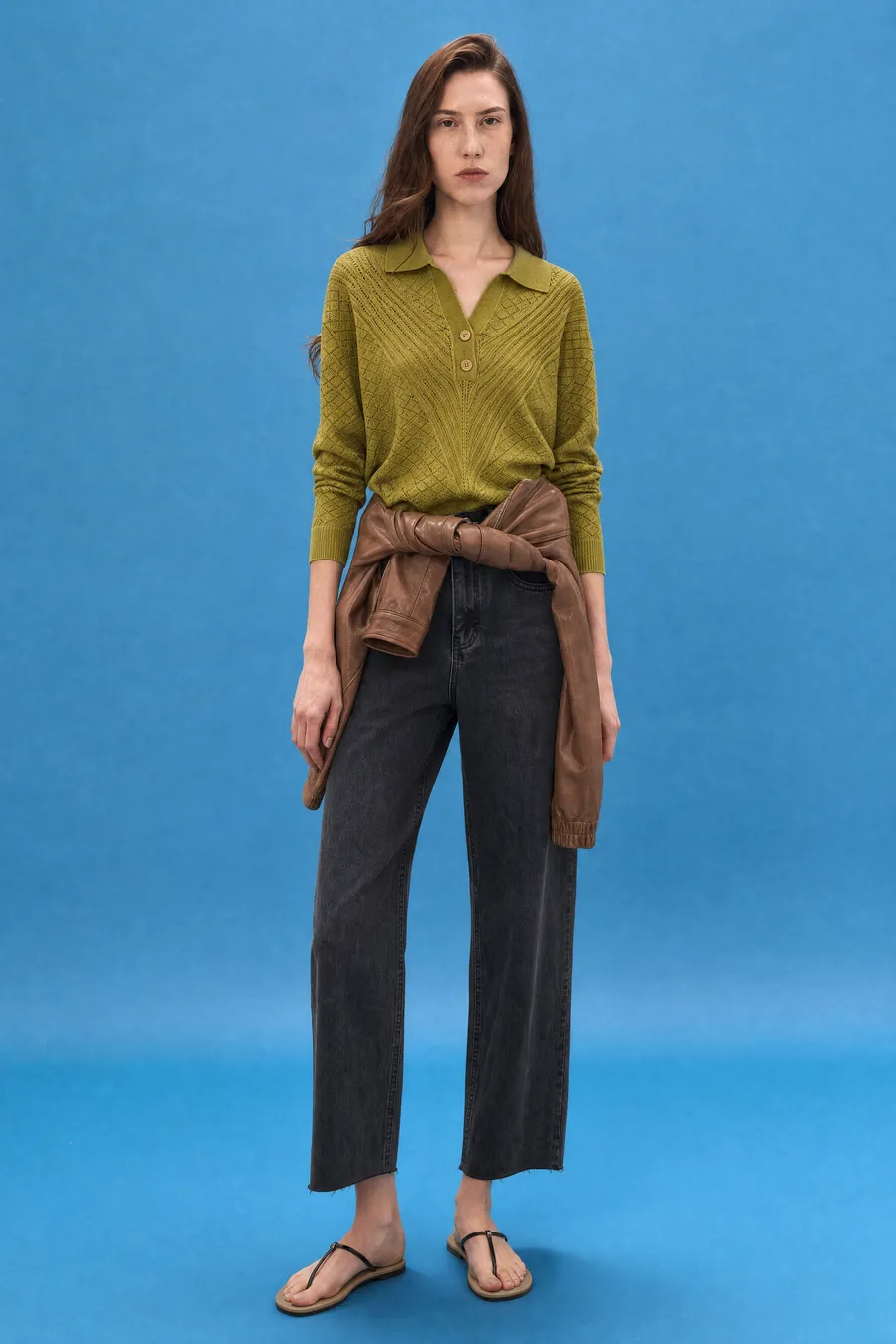 Delucca Spring Collection: on-model look 1 on a blue studio backdrop