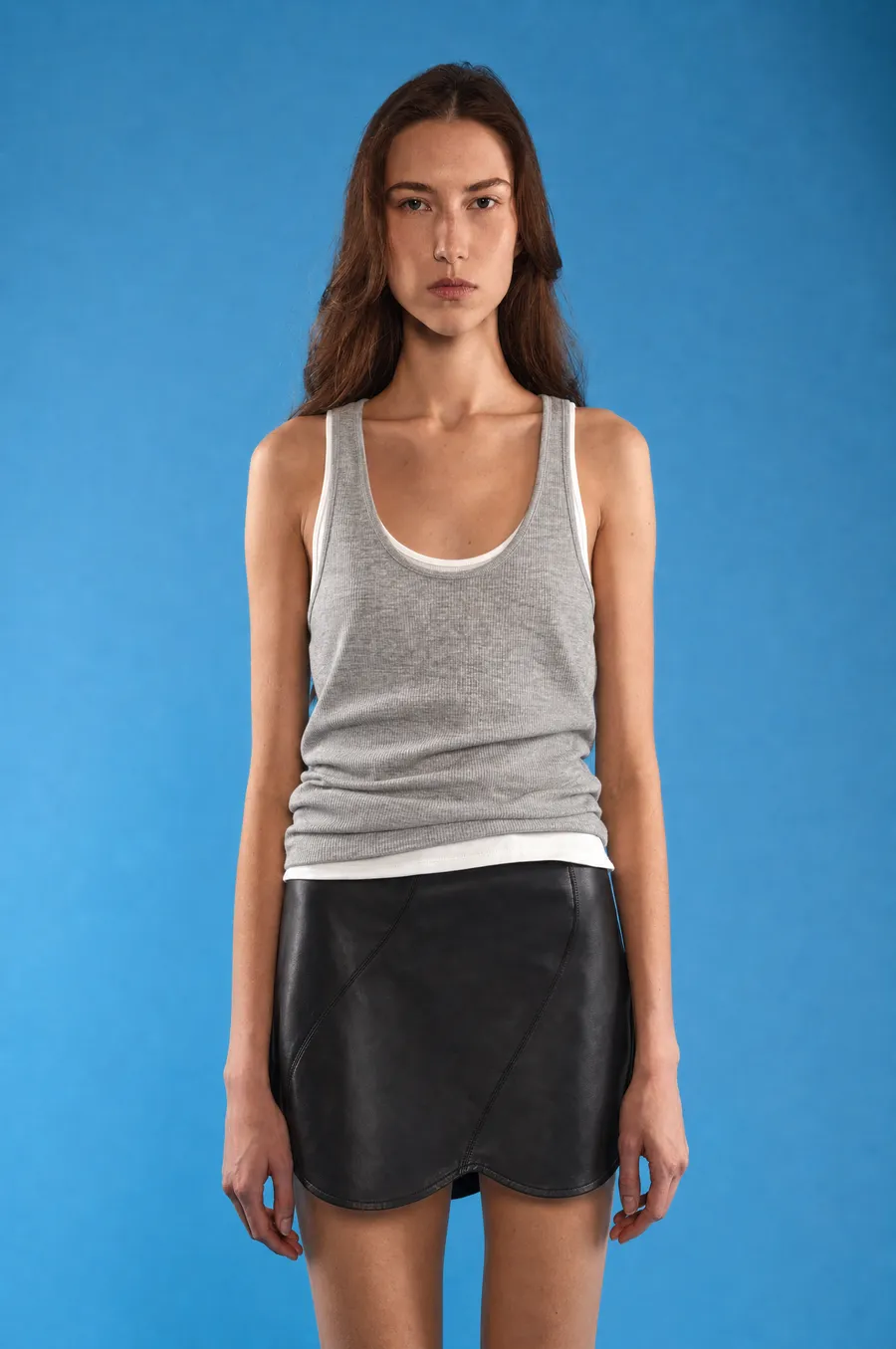 Delucca Spring Collection: on-model look 8 on a blue studio backdrop