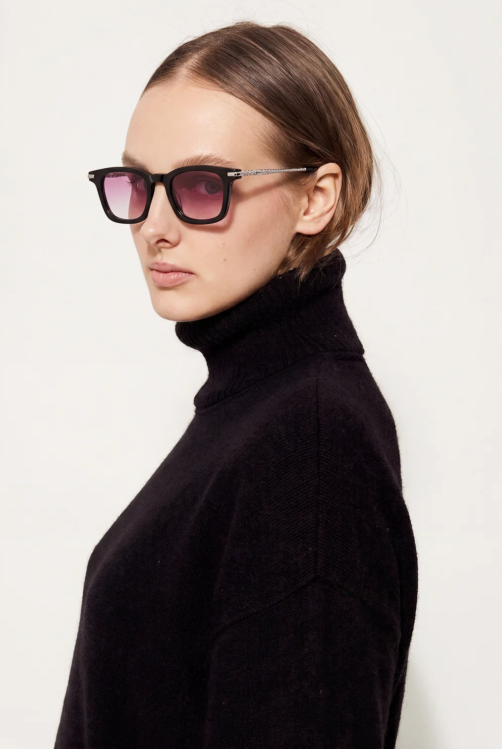 Model in a black turtleneck in side profile wearing the sunglasses